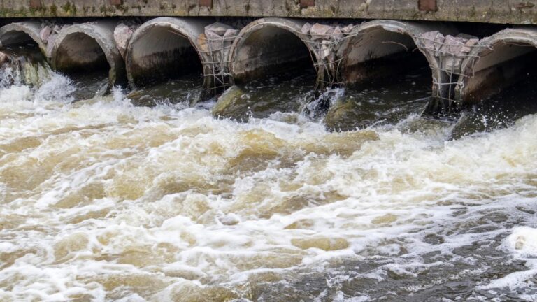 A man-made waterway with lots of water flowing through it.