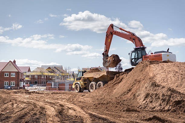 A construction site with large construction vehicles.